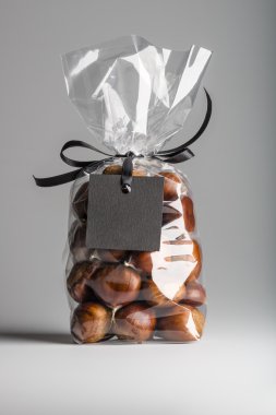 Luxury gift with ribbon of chestnuts with black blank label