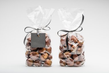 Twin elegant plastic bags of sweet chestnuts for gift
