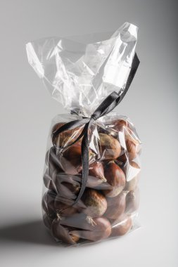 Bird view on isolated luxury plastic bag of sweet chestnuts