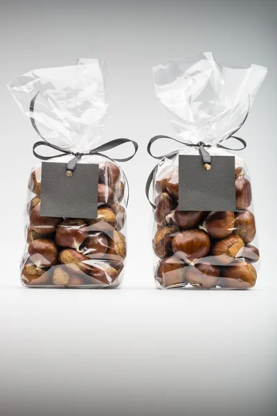 Gifts of fresh chestnuts with blank label and copy space — Stok fotoğraf