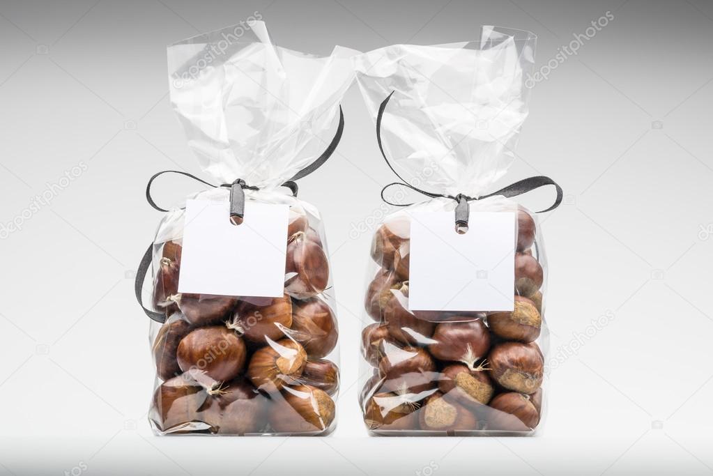 Twin elegant plastic bags of fresh chestnuts for gift