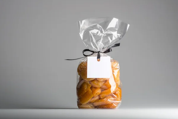 Bag of candied apricots with blank label and copy space — Stock Photo, Image
