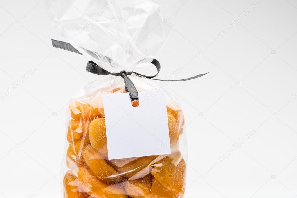 Closeup on bag of organic dried apricots with blank label