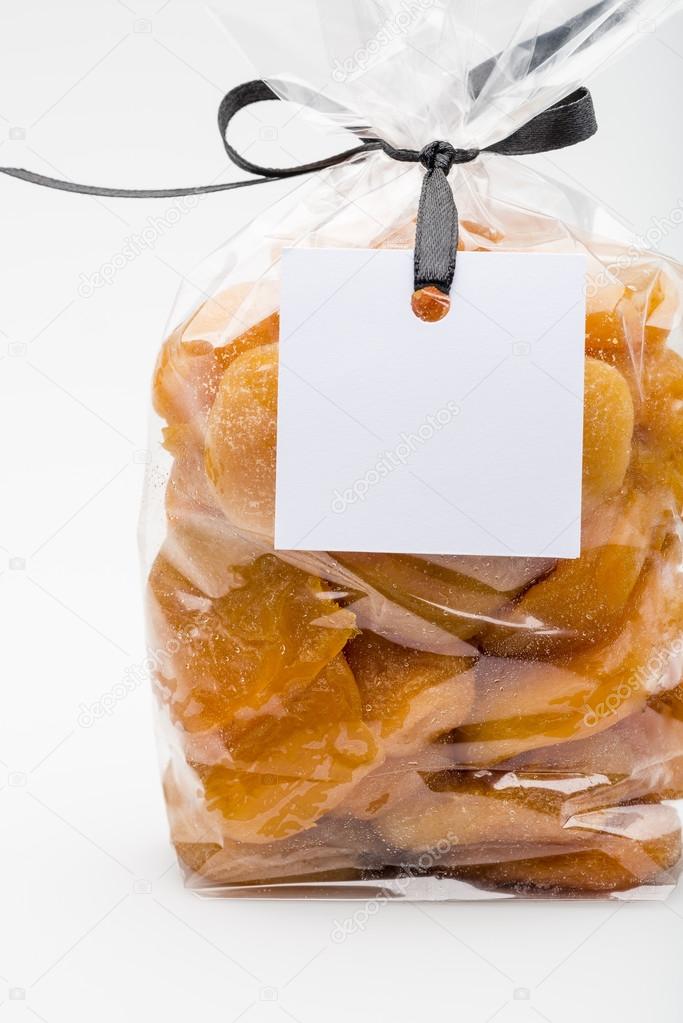 Closeup on luxury bag of dried apricots with blank label