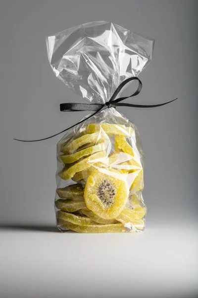 Luxury bag of dried kiwi slices isolated on grey background. — Stock Photo, Image