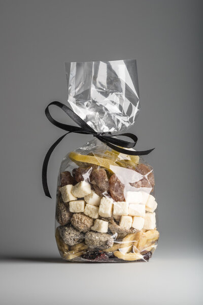 Assorted organic dried fruits into luxury transparent plastic ba