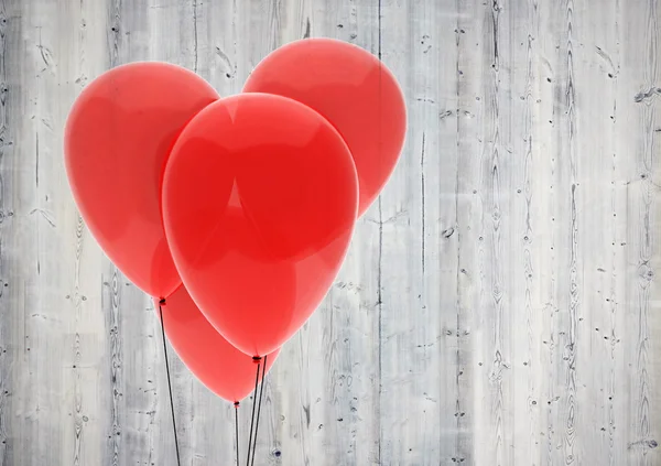 Red balloon heart on wood background — Stock Photo, Image