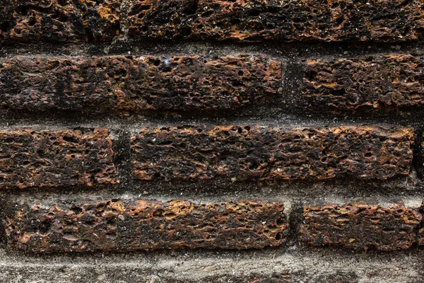 Parede de tijolo laterite velho — Fotografia de Stock