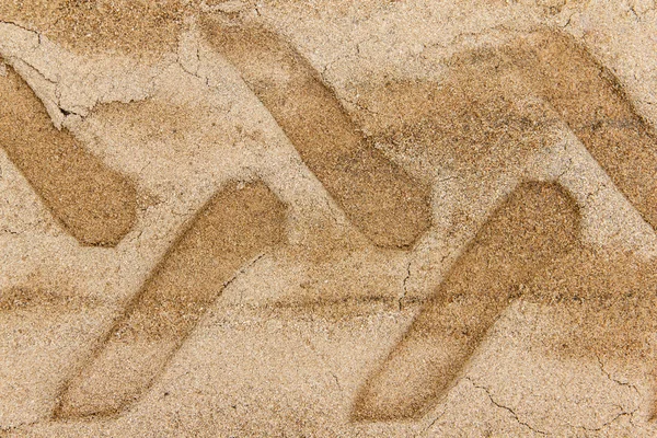 Pista de rodas no chão de areia Imagem De Stock