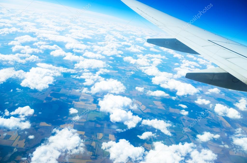 Flight above a ground in a blue sky