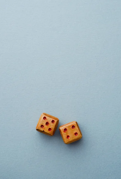 Wooden dices over blue — Stock Photo, Image