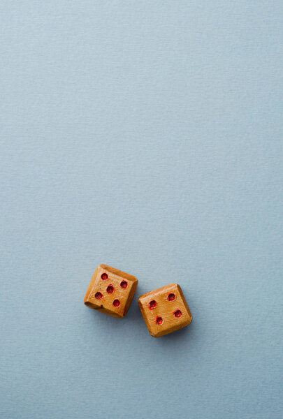 Wooden dices over blue