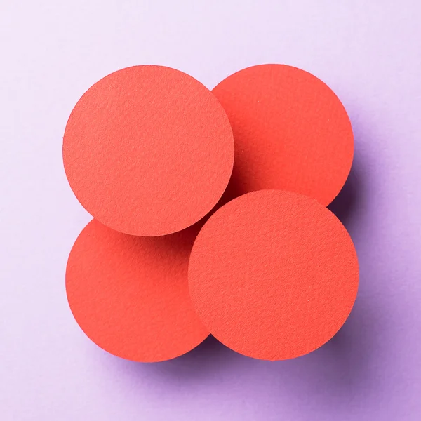 Paper circles organized over purple — Stock Photo, Image