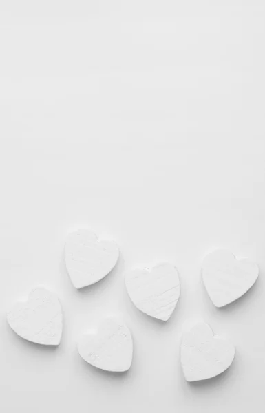 Wooden hearts over white — Stock Photo, Image