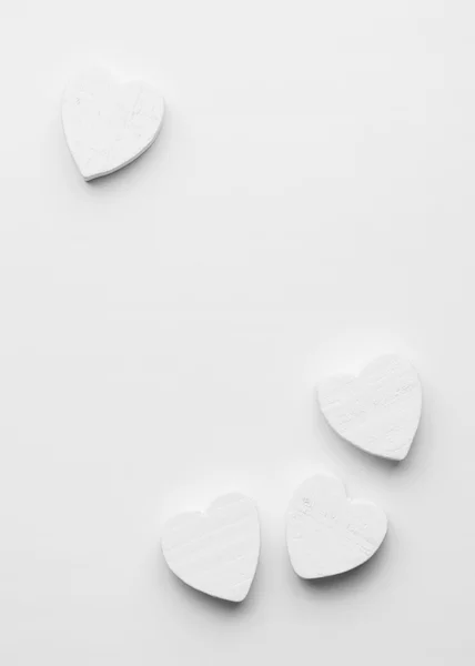 Wooden hearts over white — Stock Photo, Image