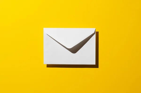 Envelope with harsh shadow — Stock Photo, Image