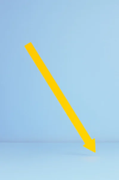 Yellow arrow pointing down — Stock Photo, Image