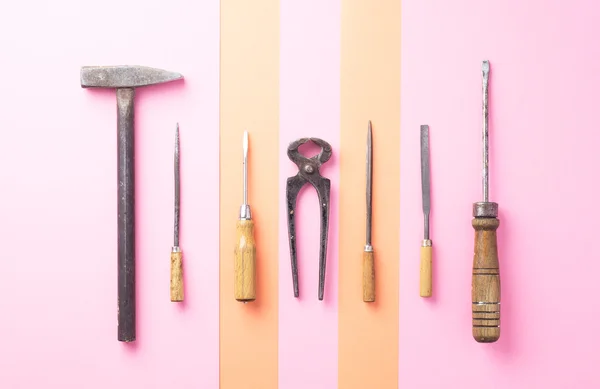 Work tools over orange and pink