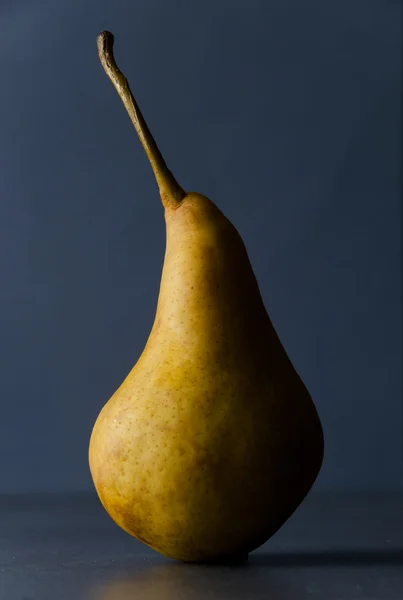 Ripe pear on dark background — Stock Photo, Image