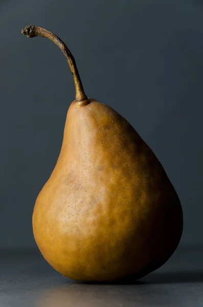 Ripe pear on dark background — Stock Photo, Image