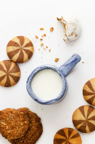 Milk and different cookies — Stock Photo, Image