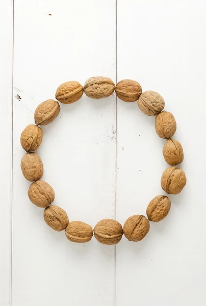 Walnuts arranged in a circle — Stock Photo, Image