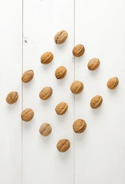 Walnuts arranged in a symmetric rhomb shape — Stock Photo, Image