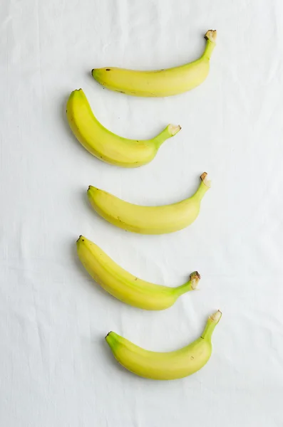 Bananas in a row — Stock Photo, Image