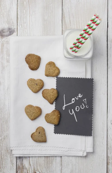 "I love you "card, milk and cookies — стоковое фото