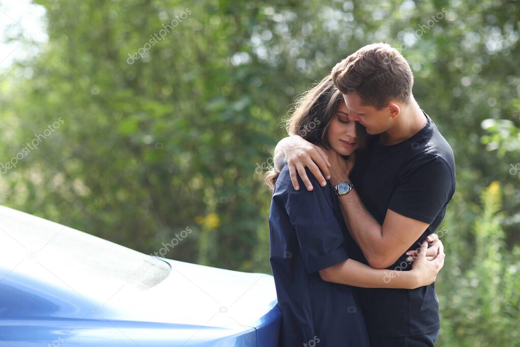 Lovely couple is traveling with a car