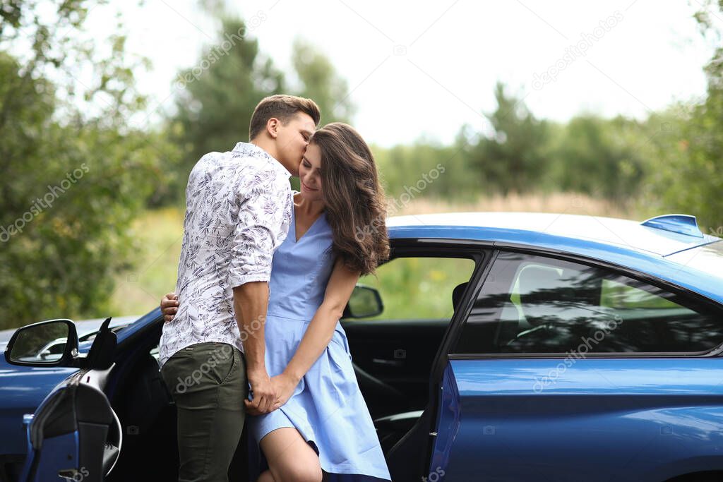 Lovely couple is traveling with a car