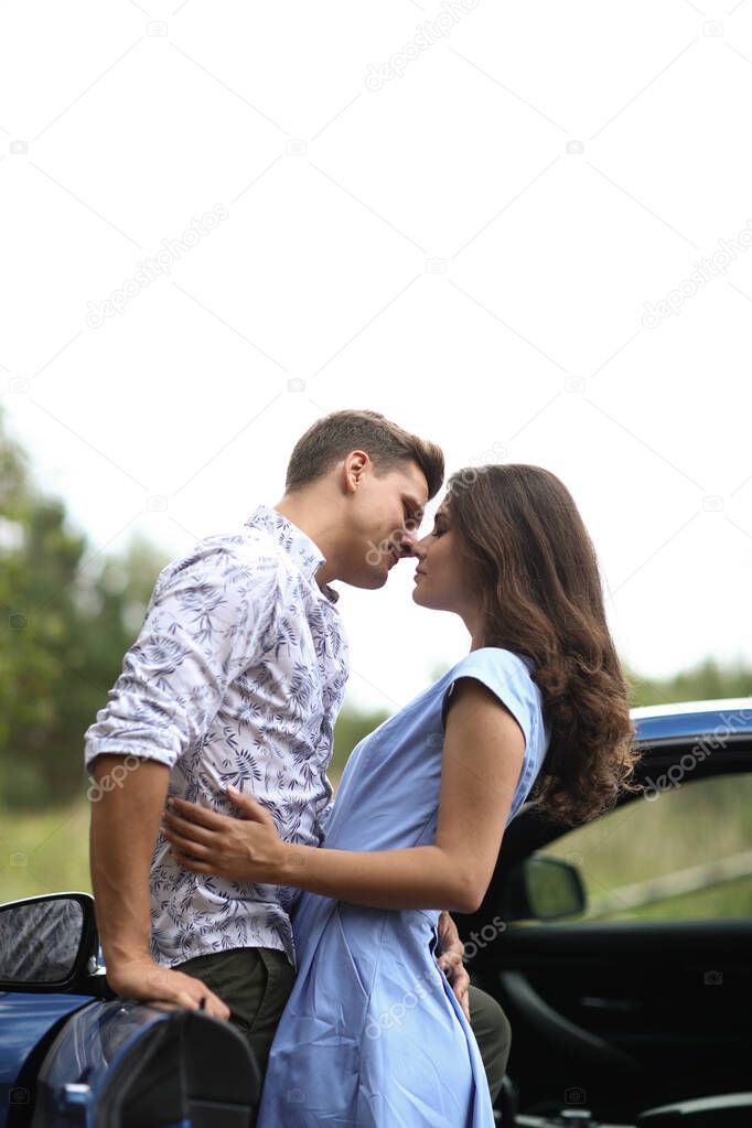 Lovely couple is traveling with a car