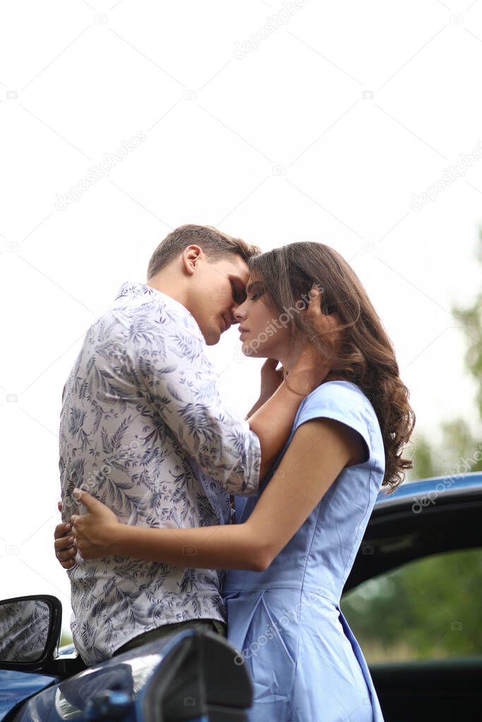 Lovely couple is traveling with a car