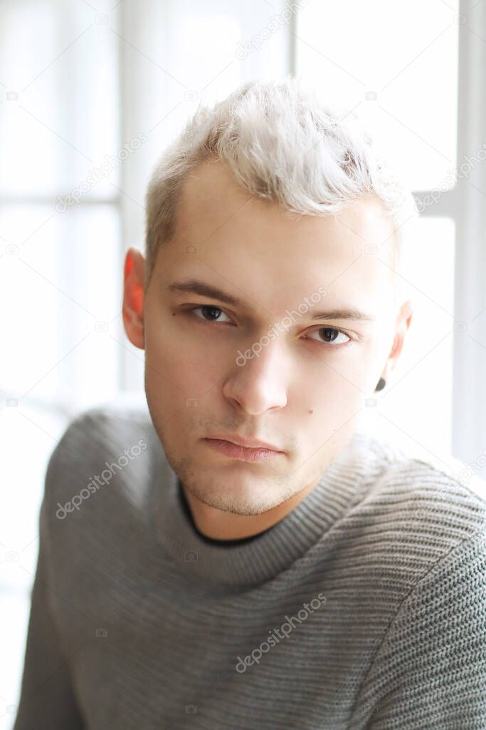 Young man with white hair