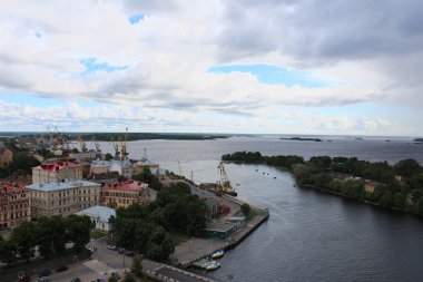 View from an observation deck of Vyborg Castle on the harbor. clipart