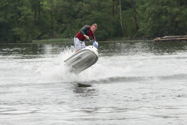 Action Photo Man on seadoo (en inglés). Trucos de Jet Ski . — Foto de Stock