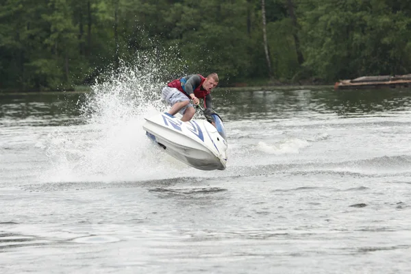 Action Photo Man on seadoo (en inglés). Trucos de Jet Ski . —  Fotos de Stock