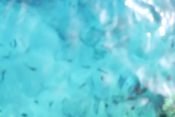 Hintergrund Des Verschwommenen Blauen Wassers Mit Sonnenreflexion — Stockfoto