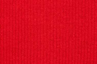 Doğal kırmızı çizgili yünün dokusu. Sıcak bir kazak için kumaş. Model için arkaplan