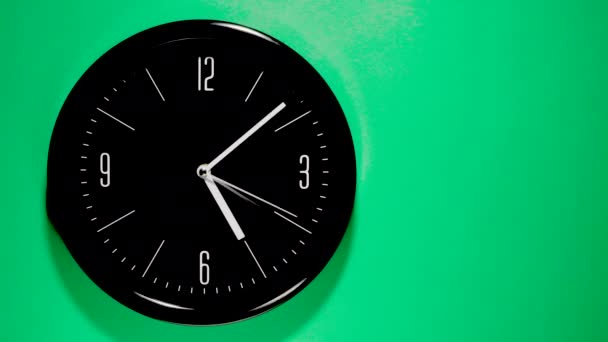 Time Lapse Movements Analog Black Face Clock Green Background — Stock Video