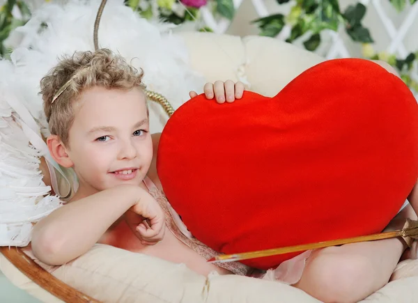 Baby cupid with heart — Stock Photo, Image