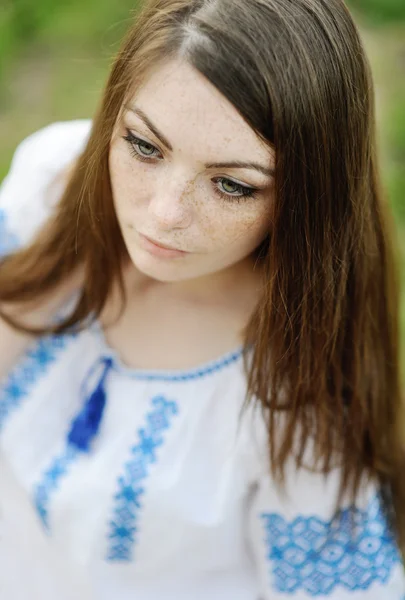 Girl with freckles on her face in a Ukrainian shirt — Stock Photo, Image