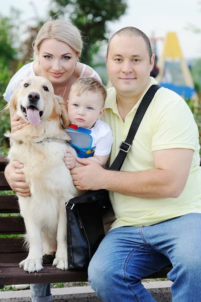 Family with a dog retriever — Stok fotoğraf
