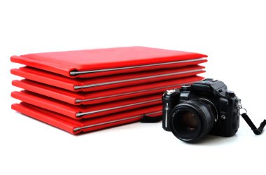 the camera on the background of photo books. graduation photo clipart