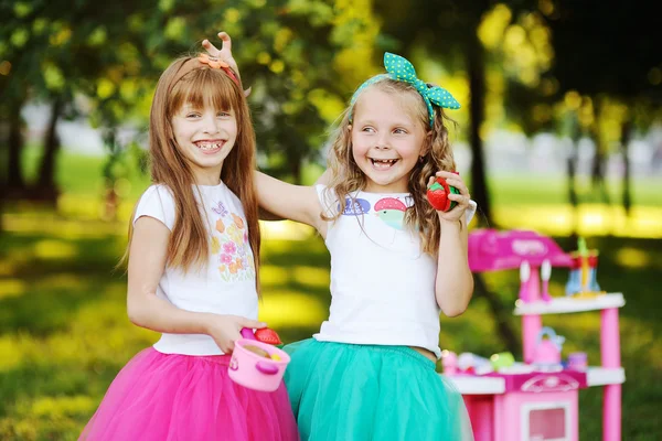 Little girls playing in the kitchen — Stock Photo, Image