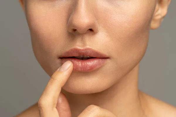 Close Woman Applying Moisturizing Nourishing Balm Her Lips Her Finger — Stock Photo, Image