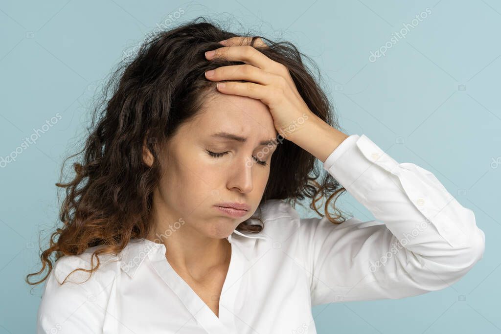 Studio portrait of tired frustrated business woman or office worker sighing and wiping sweat of forehead, has emotional burnout, exhausted by long work during hot weather in the office, isolated.
