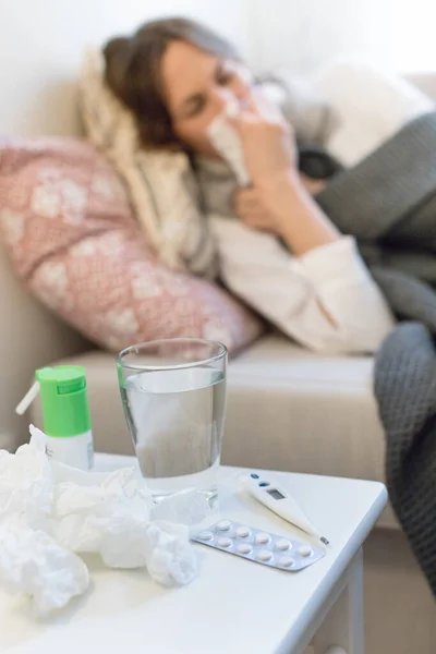 Blurred Sick Woman Lying Sofa Plaid Sneezing Focus Thermometer Pills — Stock Photo, Image