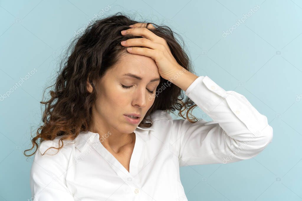 Tired frustrated business woman office worker sighing wiping sweat of forehead has emotional burnout