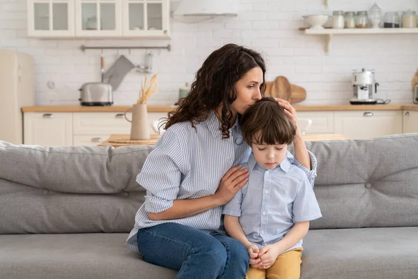 Ending of family fight: mother feel guilty embrace disobedient son after scolding for misbehavior